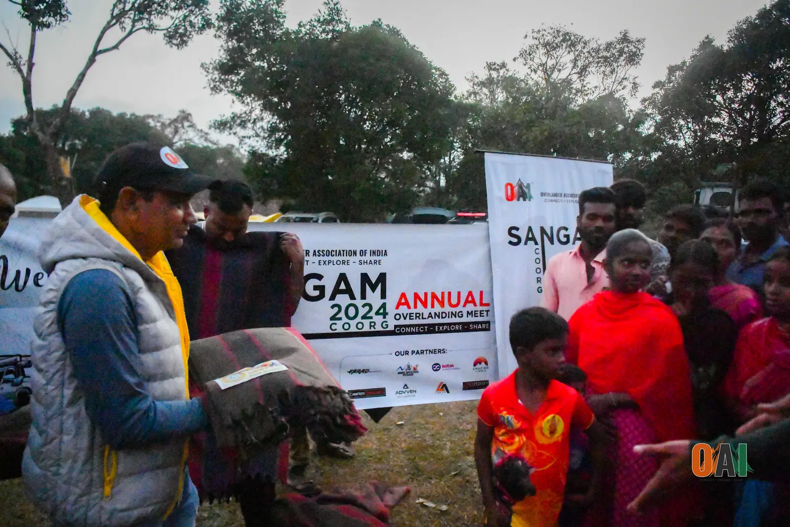 OAI members distributing blankets at a Sangam annual meet
