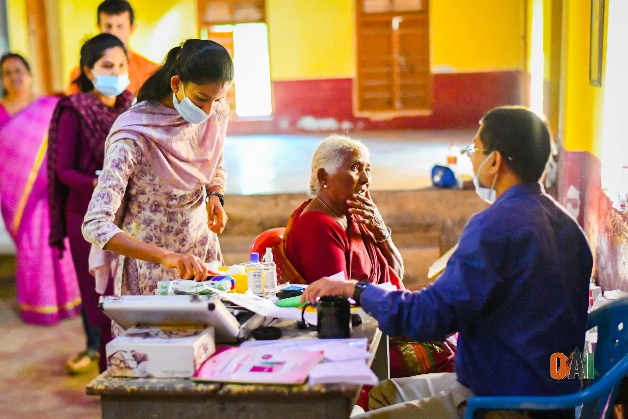 An OAI volunteer doctor examining a patient at a rural medical camp