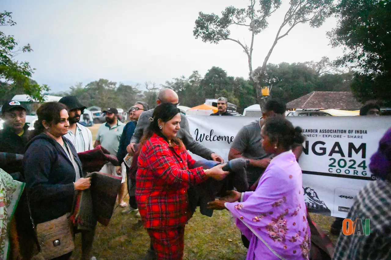 OAI members distributing blankets to villagers near Theralu Village